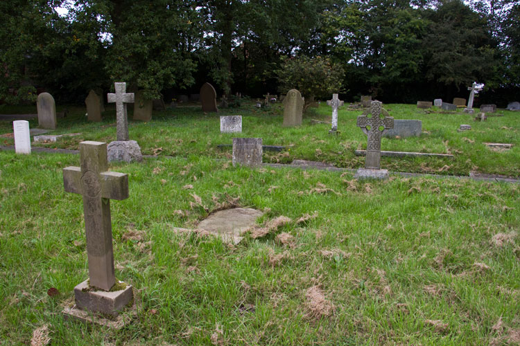 The headstone for Private Abbott (lying flat) in Hungtington (All Saints') Churchyard 