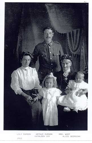 A photograph taken in 1912 showing Lily Curson, Arthur Curson, Kathleen Joy Curson, Mrs Wort, and Alice Georgina Curson