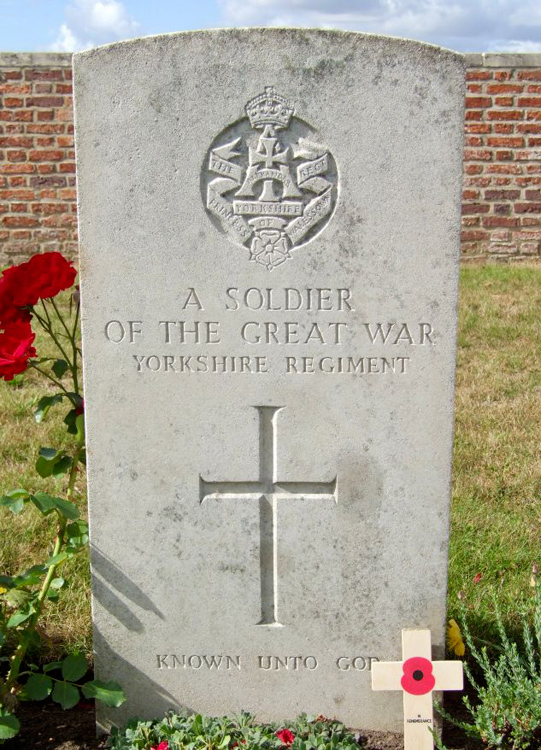 The Grave of an Unidentified Yorkshire Regiment Soldier in Buffs Road Cemetery, Belgium.